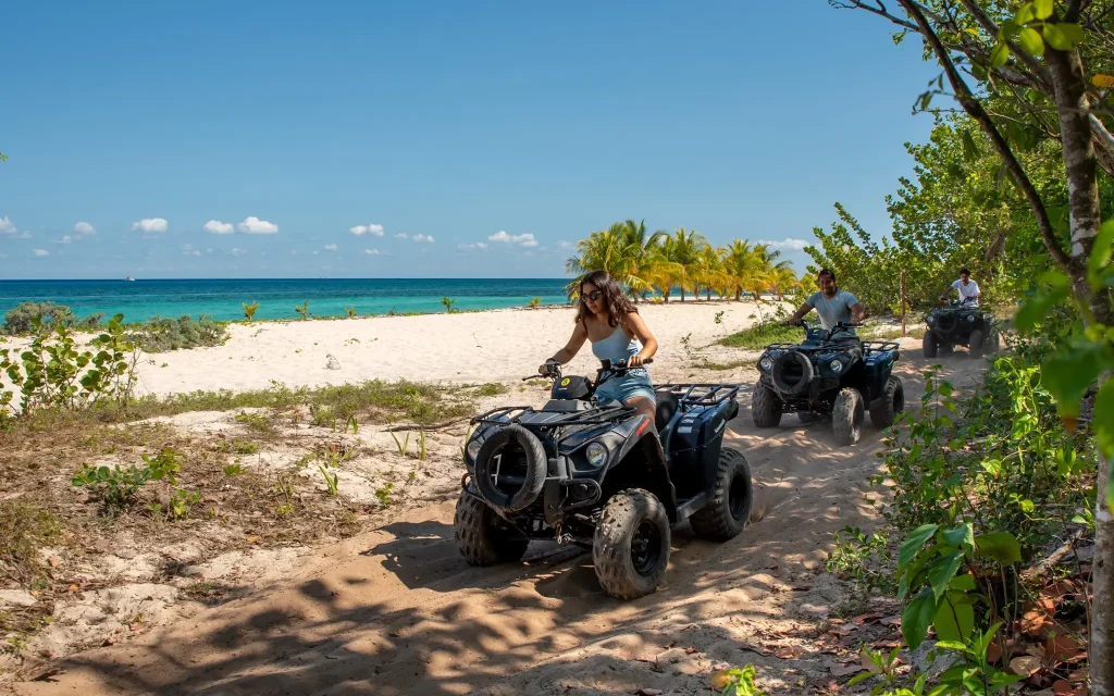 Many ATVs riding by the beach