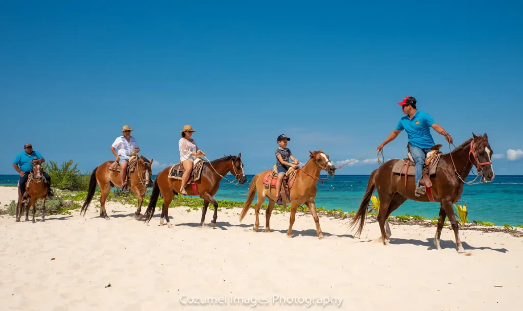 Family horse back riding together